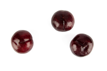 Obraz premium Fresh Black plums isolated on white background 