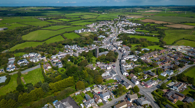 Aerial drone photo of the village of Kilkhampton in North Cornwall under a bright blue sky
