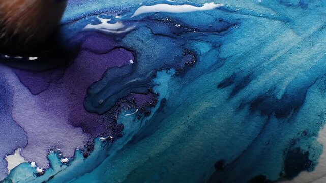 Abstract paint strokes blending blue and purple hues creating fluid forms