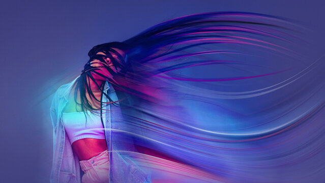 Expressive mixed media abstract portrait of dancing woman with color trails. Concept of freedom, joy, self expression for music visuals, youth branding, lifestyle advertising.