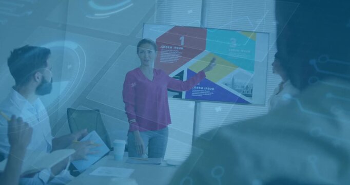 Business presenter pointing display after peer tapping tablet animating graphics emphasizing points
