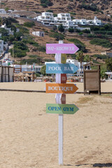 View of various wooden signs, at the beach of Mylopotas in Ios Greece