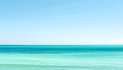 Obraz premium Tranquil seascape with clear blue sky, vibrant turquoise water horizon