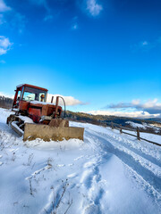 Mystical snowy Carpathian peaks under cloudy skies in the sunny weather