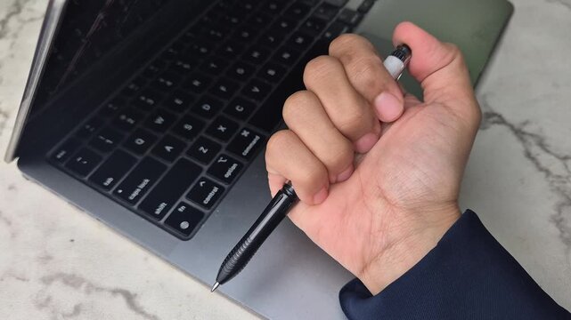 Playing click pen, isolated laptop background