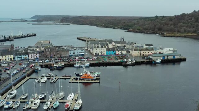 Drone shot of Stornoway harbour and town centre on a cloudy day.