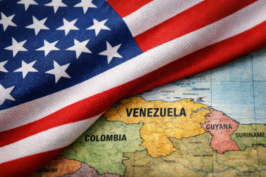 United States flag covering map of Venezuela, politics