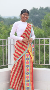 Young indian women wearing traditional lungi Panchi saree 