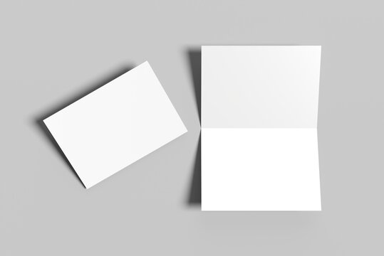 Bi fold vertical - landscape brochure or invitation mock up isolated on gray background.