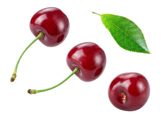 three plump, dark red cherries, one showcasing a bright green leaf and two distinct stems, presented elegantly on a solid transparent background.