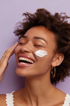 Woman side view laugh happily with lotion on cheeck smile laughing person.