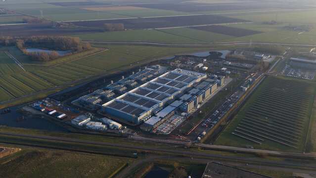 Aerial view of the sprawling Google Data Center, a fortress of technology amidst a landscape of agricultural fields, Winschoten, Groningen, Netherlands.