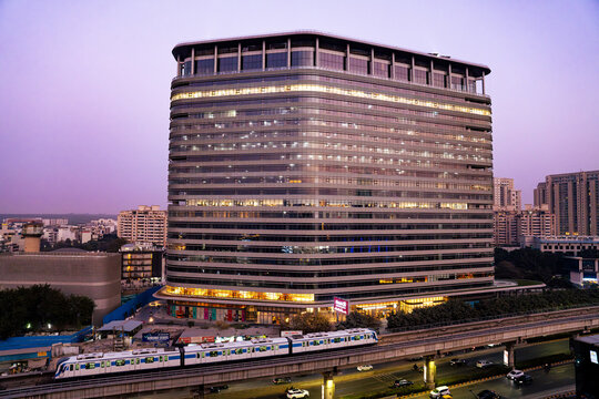 Gurgaon Rapid Metro passing near Cyber City, showcasing modern public transportation and corporate infrastructure in Gurugram, Haryana. Represents urban mobility, business districts, and smart city.