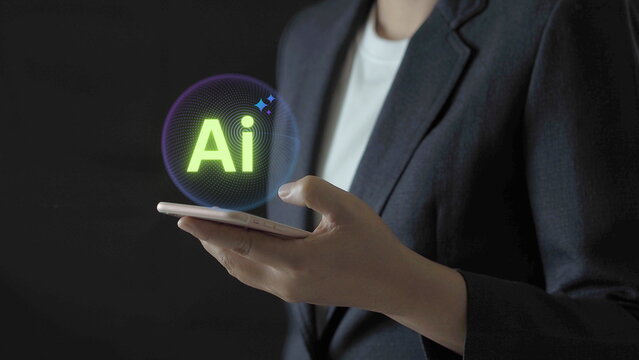 Businesswoman using smartphone with artificial intelligence interface, representing AI technology, digital innovation, automation, smart solutions, future business and modern mobile technology. - Powered by Adobe