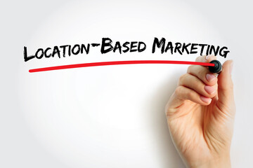 Text Location-Based Marketing written with marker and underlined in red by a hand, concept for digital advertising, GPS targeting, and marketing innovation