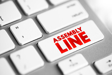 Assembly Line is a production process that breaks the manufacture of a good into steps, text concept button on keyboard