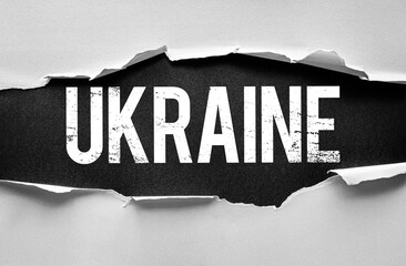 The word UKRAINE appears behind torn paper, symbolizing revelation or emergence. Grunge typography adds a raw, impactful tone - ideal for themes on politics, geography, or identity
