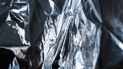 Close-up metallic foil texture with complex layered reflections