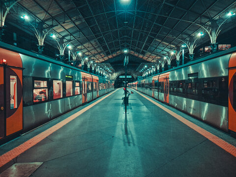 Symmetrical perspective of an empty modern metro station.