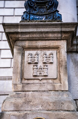 Obraz premium Bas‑relief carving of the city’s emblem, the Three Castles, on a column at the entrance of Dublin City Hall on Dame Street, symbol of the capital’s medieval origins and civic identity, Dublin, Ireland