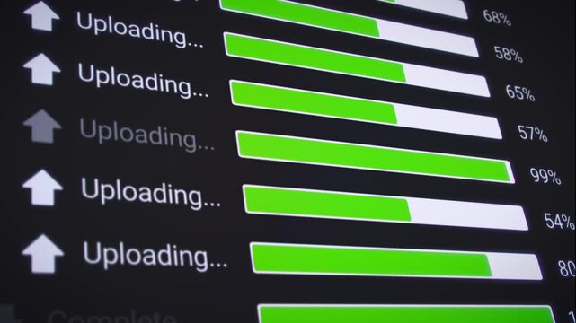Video animation of the process of uploading multiple files from the Internet on a computer monitor screen. A computer monitor displaying information about the data upload in real time, including perce