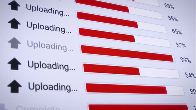 Video animation of the process of uploading multiple files from the Internet on a computer monitor screen. A computer monitor displaying information about the data upload in real time, including perce