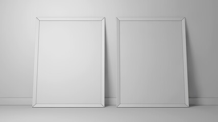 Uncluttered Display Of Two Empty Frames Leaning Against Wall With Gentle Lighting And Neutral Background