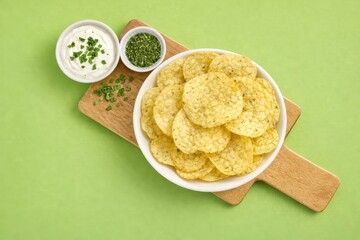 Herb Seasoned Rice Chips on Cutting Board