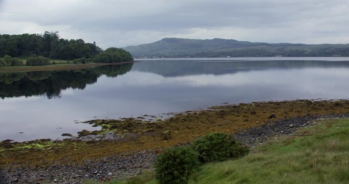 Wide shot looking down Loch Etive at Eilean Traighe,