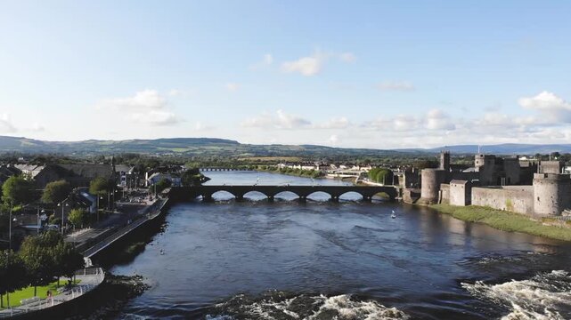 Drone over Shannon River to King John's Castle. Limerick city in Ireland. Summer