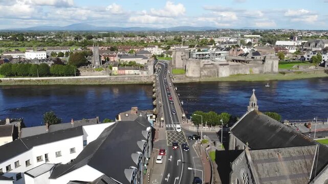 Church and Limerick Castle, dynamic drone over Thomond Bridge. Beautiful Ireland
