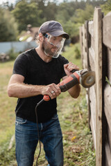 Eye and face protection when working with power tools - safety precautions in dusty work with a wood grinder