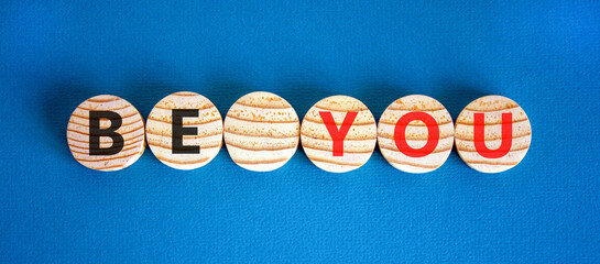 Be you support and help symbol. Concept word Be you on beautiful wooden circles. Beautiful blue background. Business be you support and help concept. Copy space.