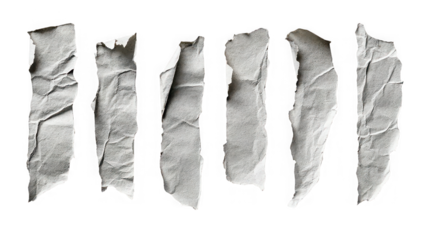 A collection of torn paper strips on a black background