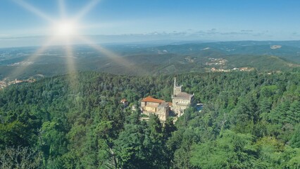 Panoramic aerial view Bussaco Palace in Luso Portugal old building castle in historical village amazing summer nature green trees forest mountains architecture traveling in Europe trip vacation travel