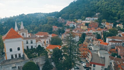 Historic town of Sintra Portugal from above with red rooftops palaces surrounded by forested hills royal legacy travel heritage European amazing nature traveling journey outdoors trip aerial view