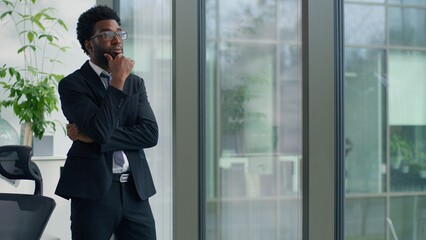 Thinking problem solution African American business man looking window in office decide trouble work job failure tired businessman hard difficult decision look think male hesitate puzzled entrepreneur