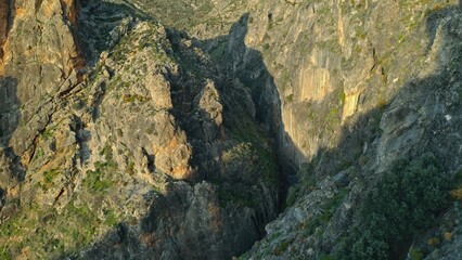 Aerial view of deep rocky canyon in Sierra Nevada mountains Spain cliffs geological formations natural wilderness landscape adventure travel destination trip adventure climbing hiking location rocks