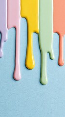 Colorful paint drips on blue textured surface