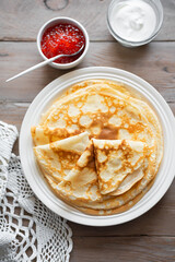 Homemade thin crepes with red caviar