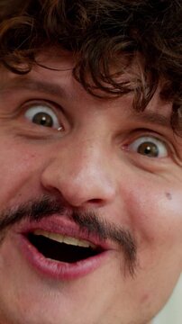 Portrait amazed Caucasian business man emotional businessman wonder surprised saying wow amazing reaction male guy excited looking at camera satisfied blink eye blinking unexpected emotion in office