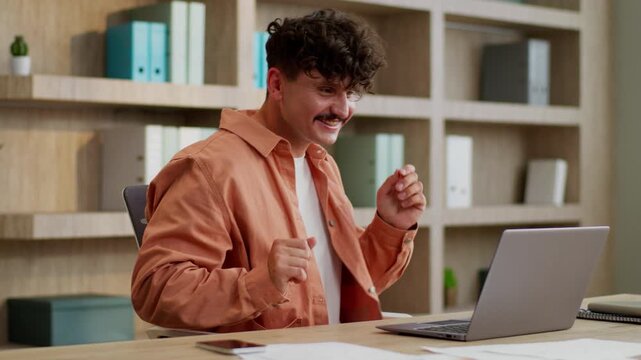Happy Caucasian business man typing laptop dancing celebrating online winning businessman working computer dance listening music rejoice internet win victory achieve guy male work success in office