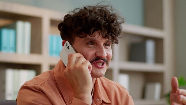 Caucasian business man talking mobile phone smiling male guy startup owner businessman talk smartphone answer call friendly discuss work project speaking cellphone smile speak leader agent in office