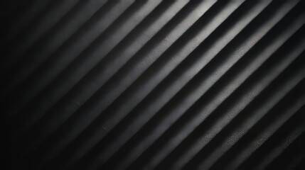 Textured dark metallic surface with diagonal stripes, modern industrial abstract background design showing metal pattern, geometric lines, contemporary steel texture for creative projects and design
