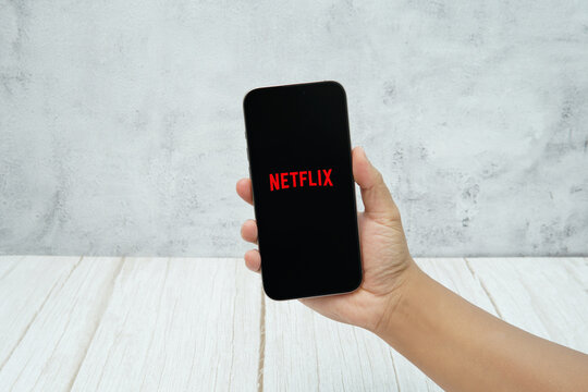 Rawang, Selangor, Malaysia - &lrm;January 21, 2026 - Hand holding smartphone displaying Netflix streaming application logo on screen.