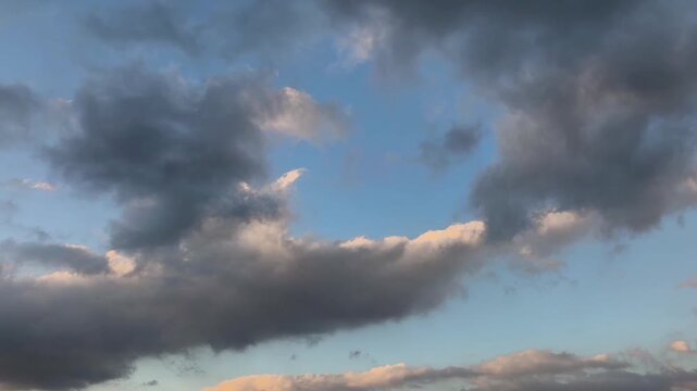 Orange and gray cloud spreads across the sky