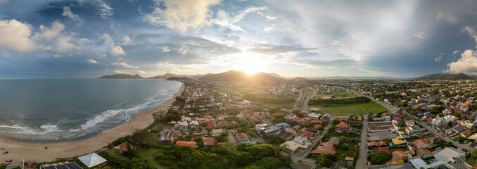Aerial panorama of the Atlantic ocean coast and calm green neighborhood near the city of Florianopolis in Brazil © Dudarev Mikhail