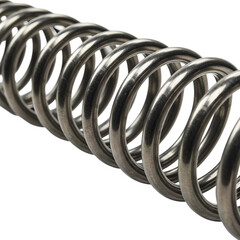 Long metallic coil spring, industrial steel hardware part isolated on transparent background.