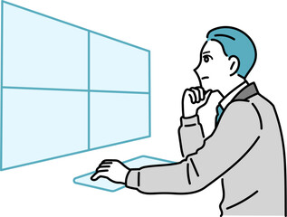 デスクで作業をしている作業着の男性のイラスト