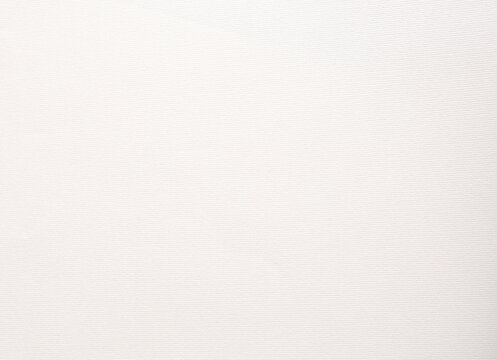 Off white textured paper background with uniform matte surface and subtle tone. Rough fine grain and